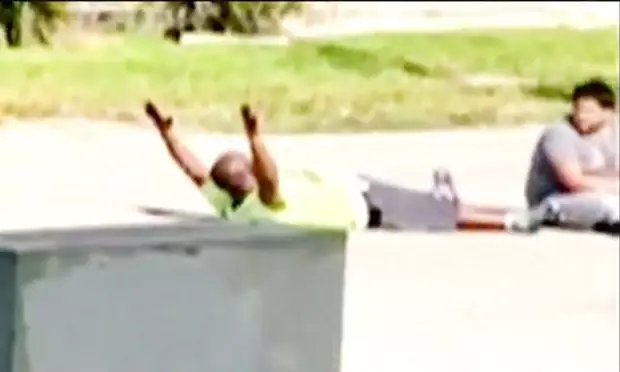 Police Shoot Unarmed Black Man As He Lies On The Ground With His Arms In The Air