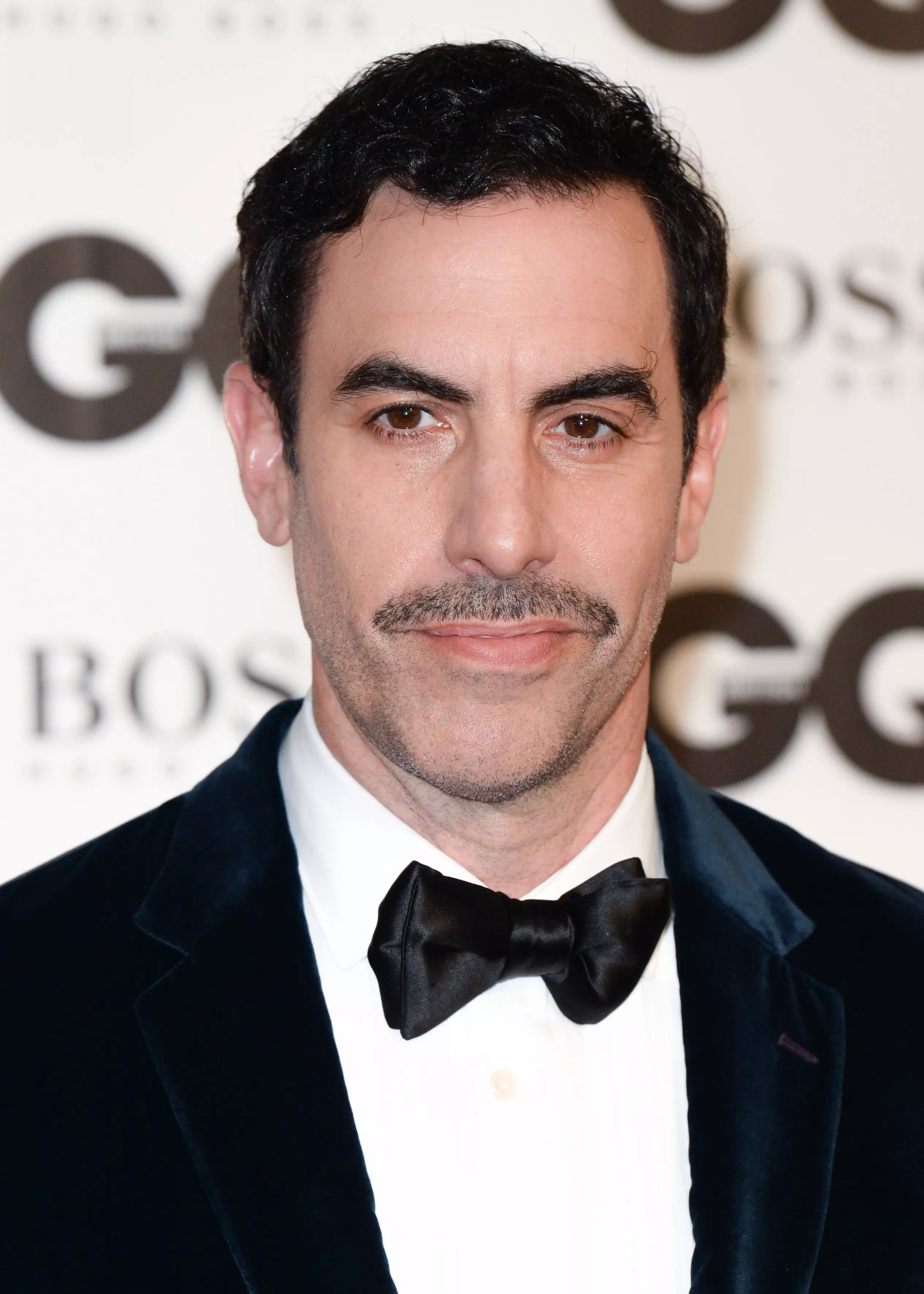 May says the Borat star would have been a 'disaster' choice to play Freddie Mercury.