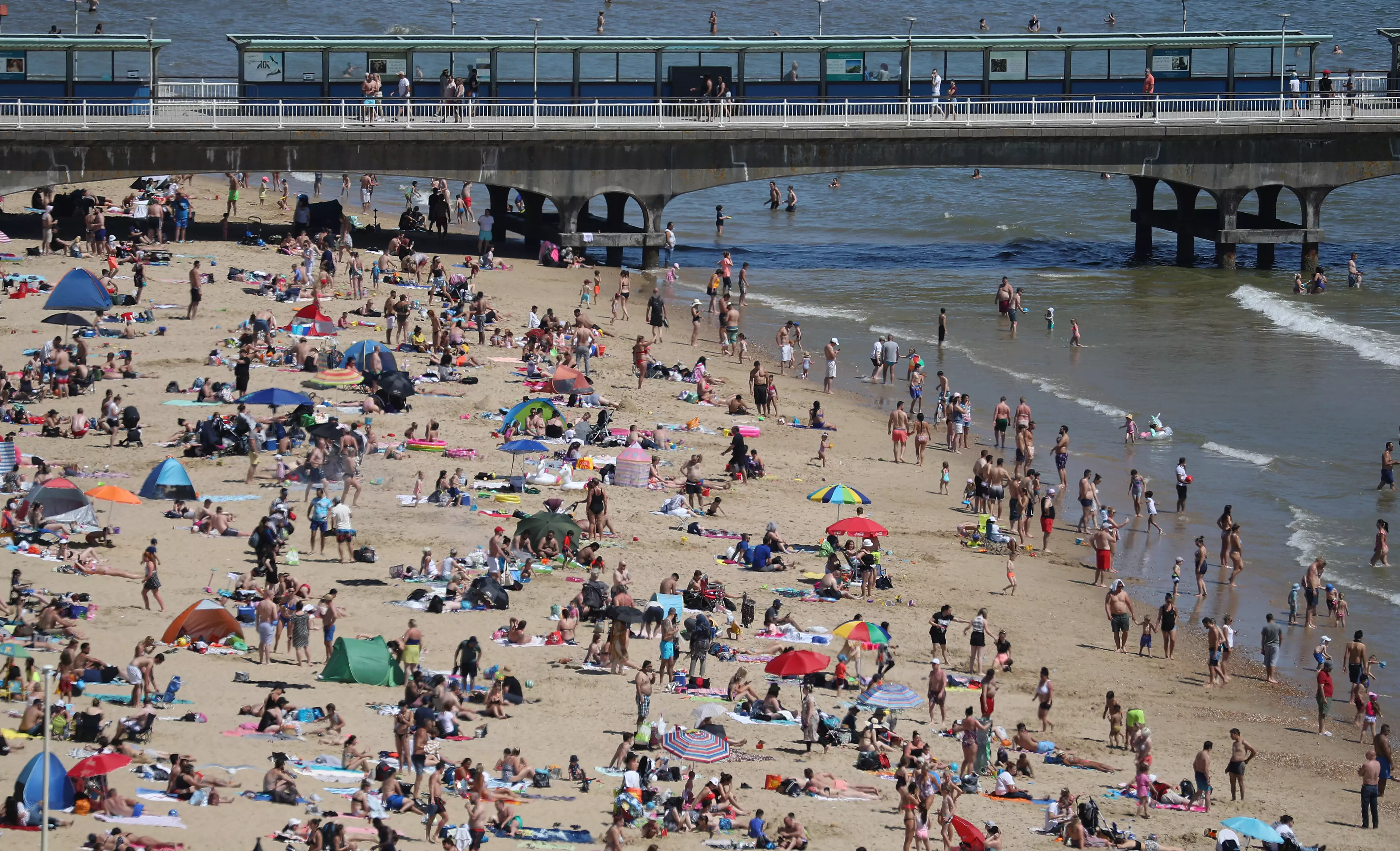 People enjoy the hot weather on Bournemouth beach.