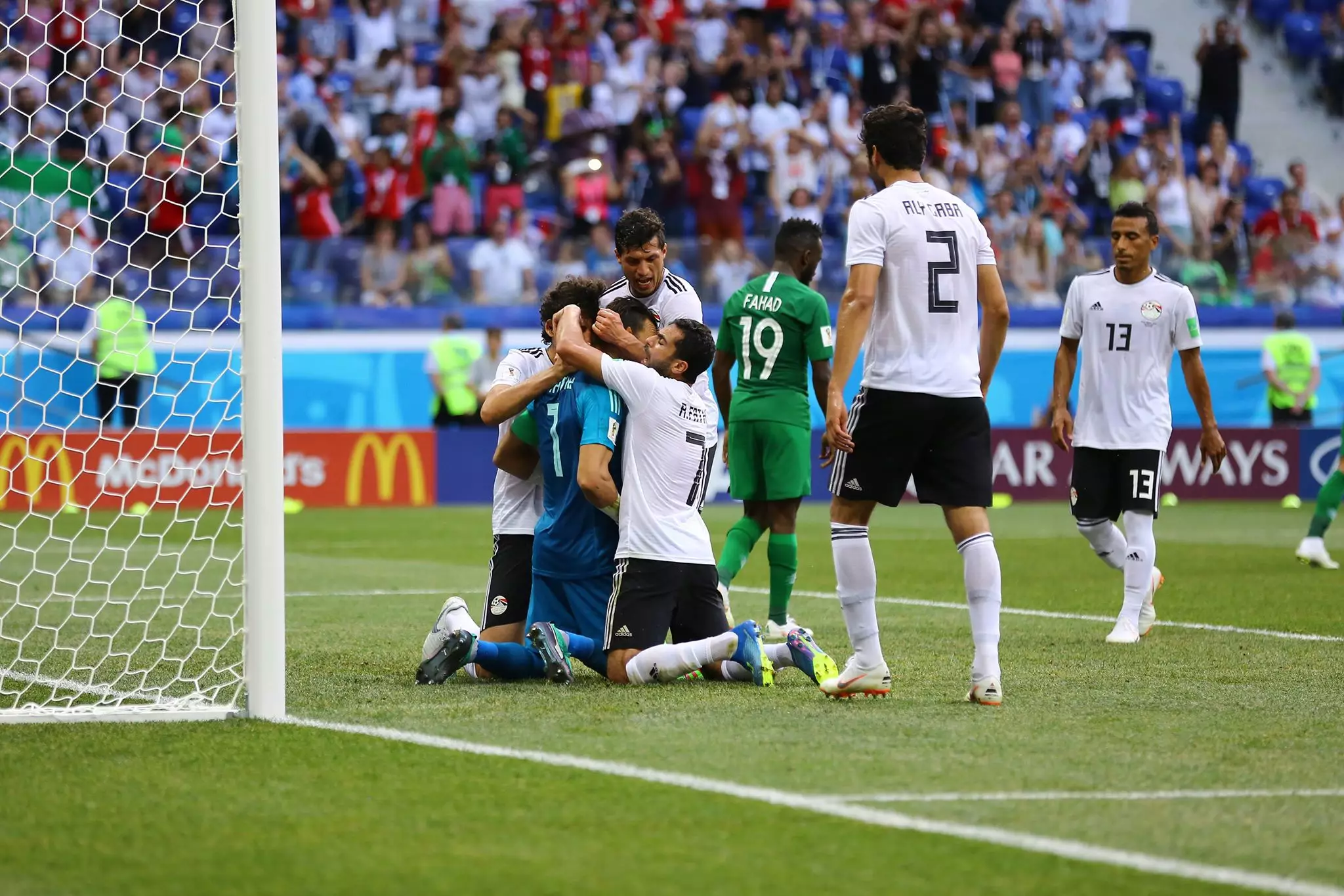 El-Hadary is engulfed by Egypt players after his penalty save. Image: PA Images
