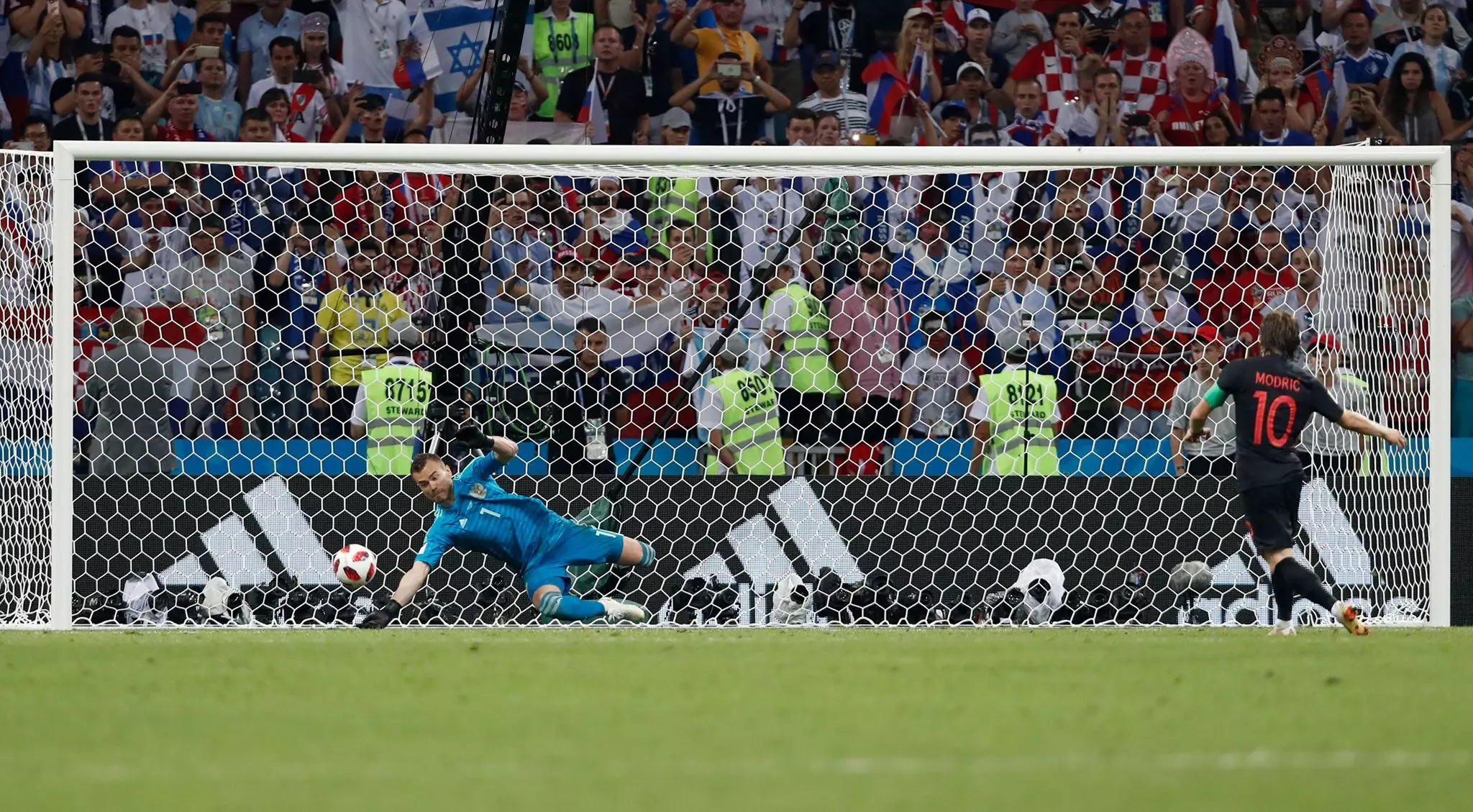 Modric just about puts his penalty away. Image: PA