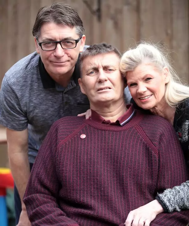 Gavin Swales (centre), pictured with wife Debbie and brother Frankie in 2015.