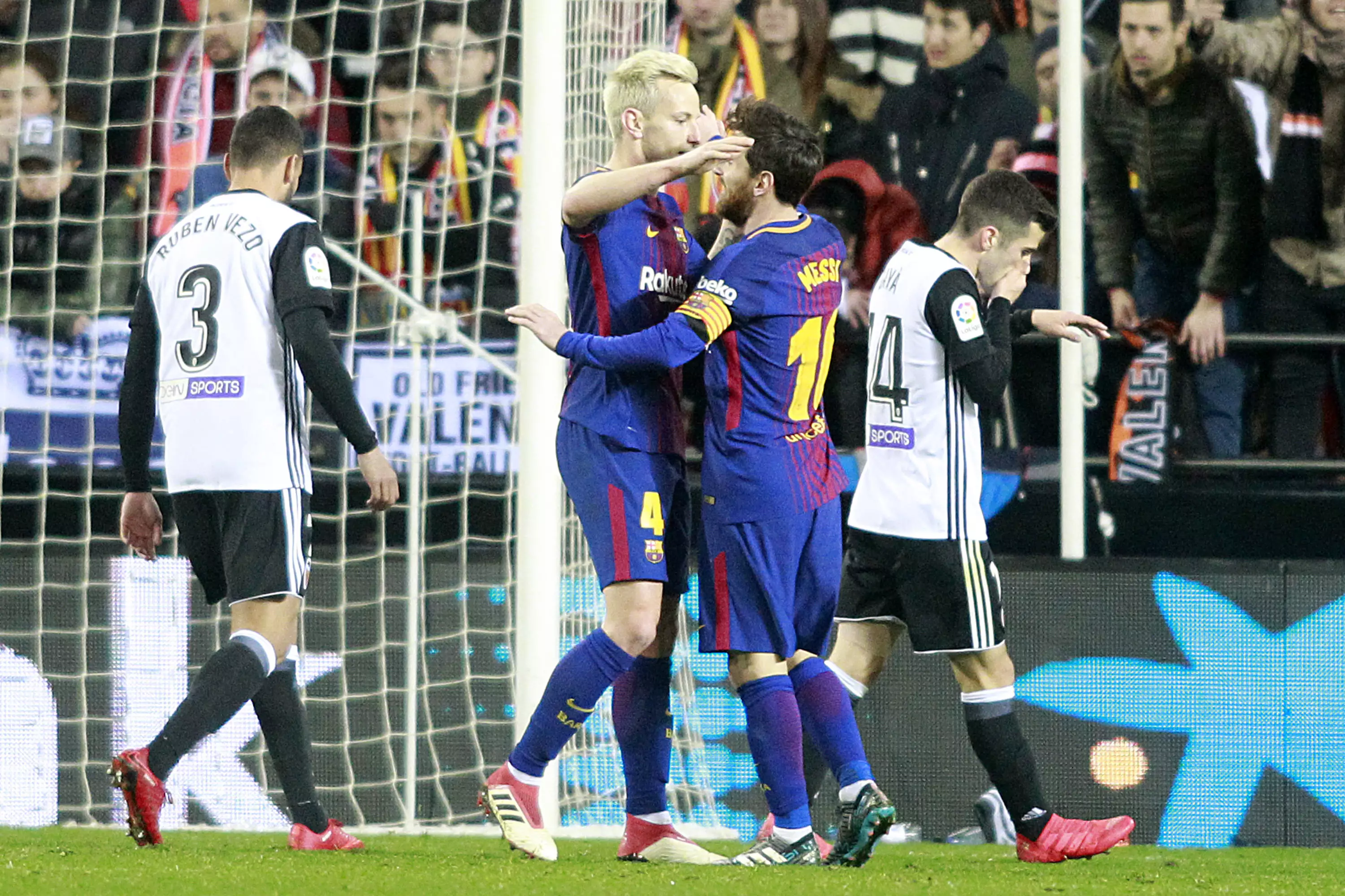 Messi celebrates with Ivan Rakitic. Image: PA