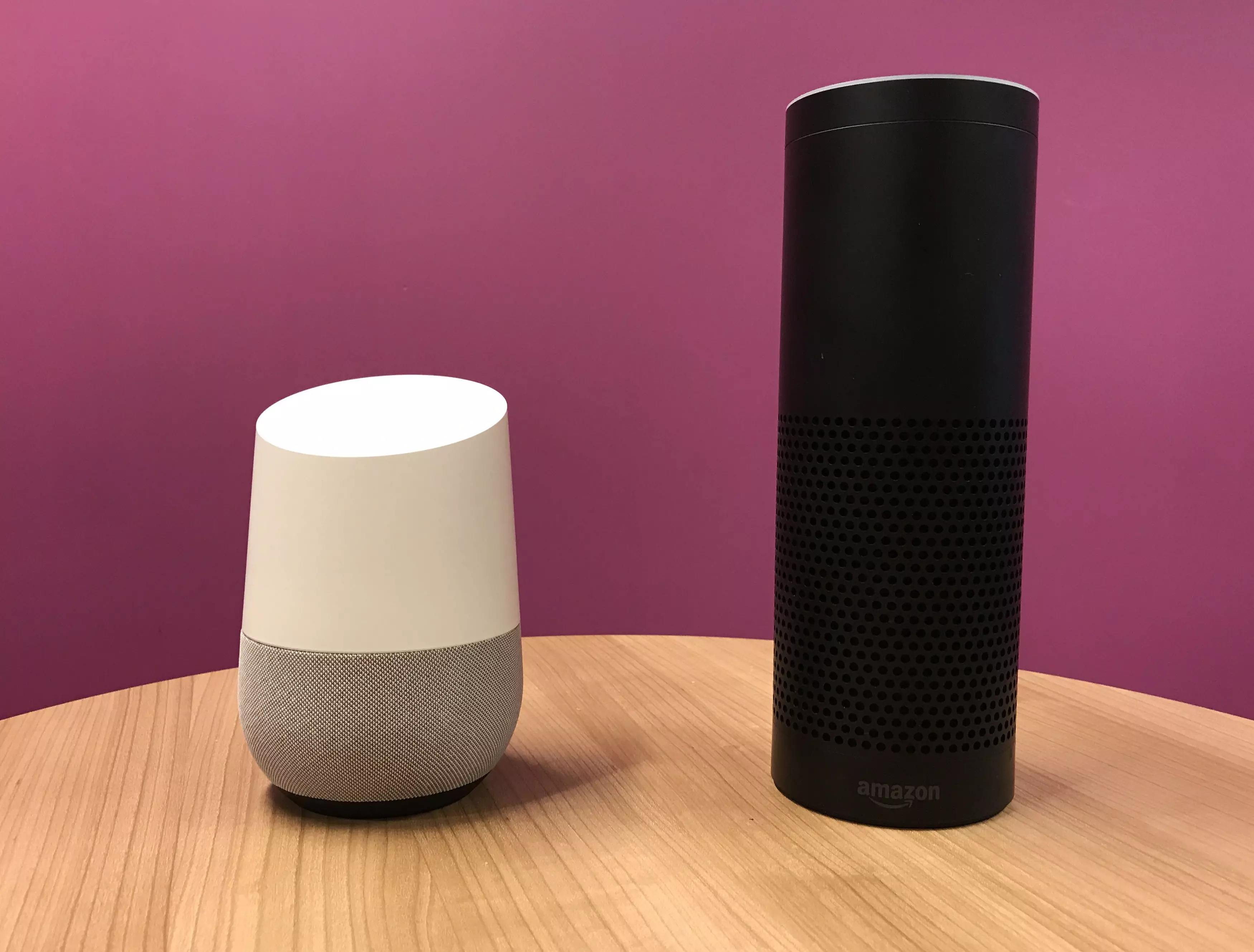 An Amazon Echo alongside a Google Home.