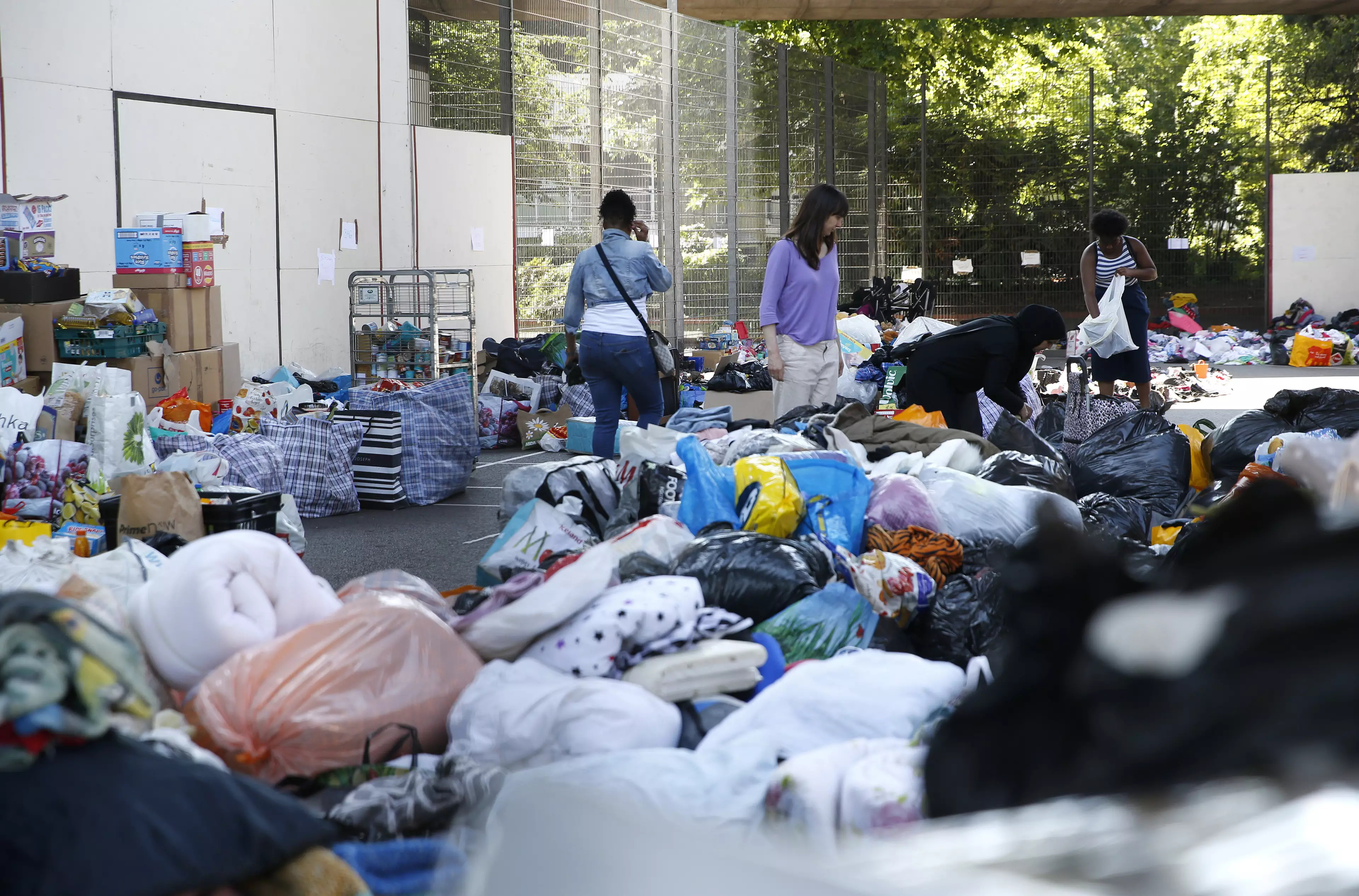 Volunteers help sort donations for those affected by the fire
