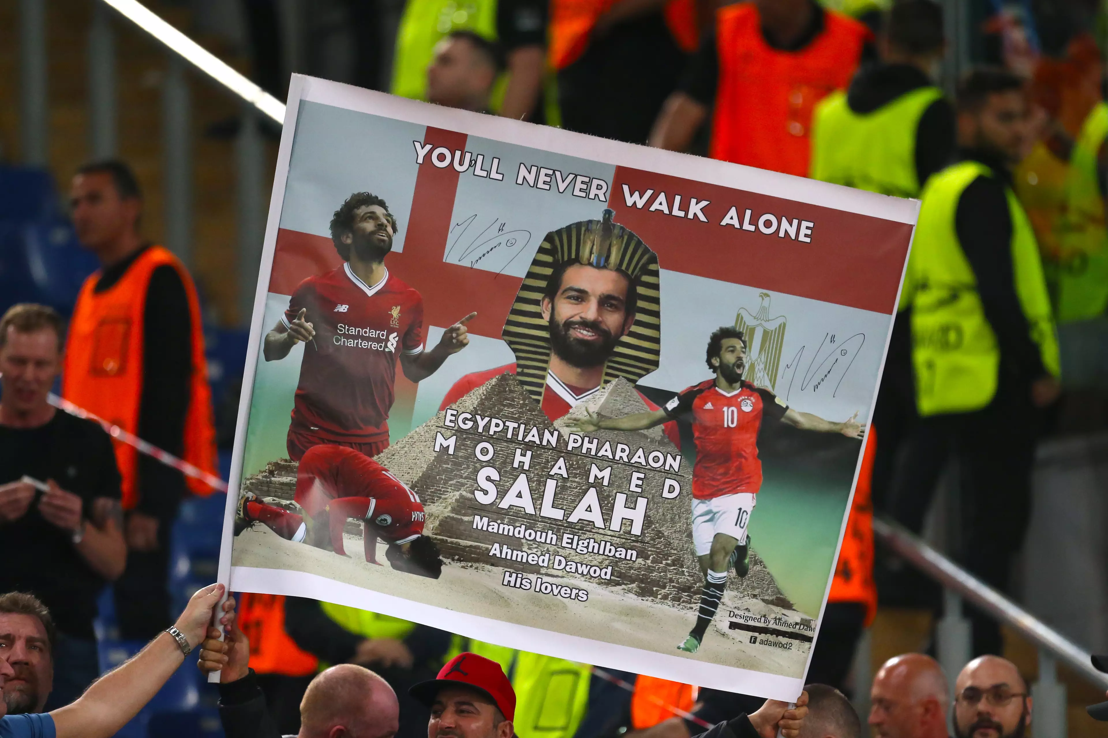 Liverpool fan holds up a banner. Image: PA