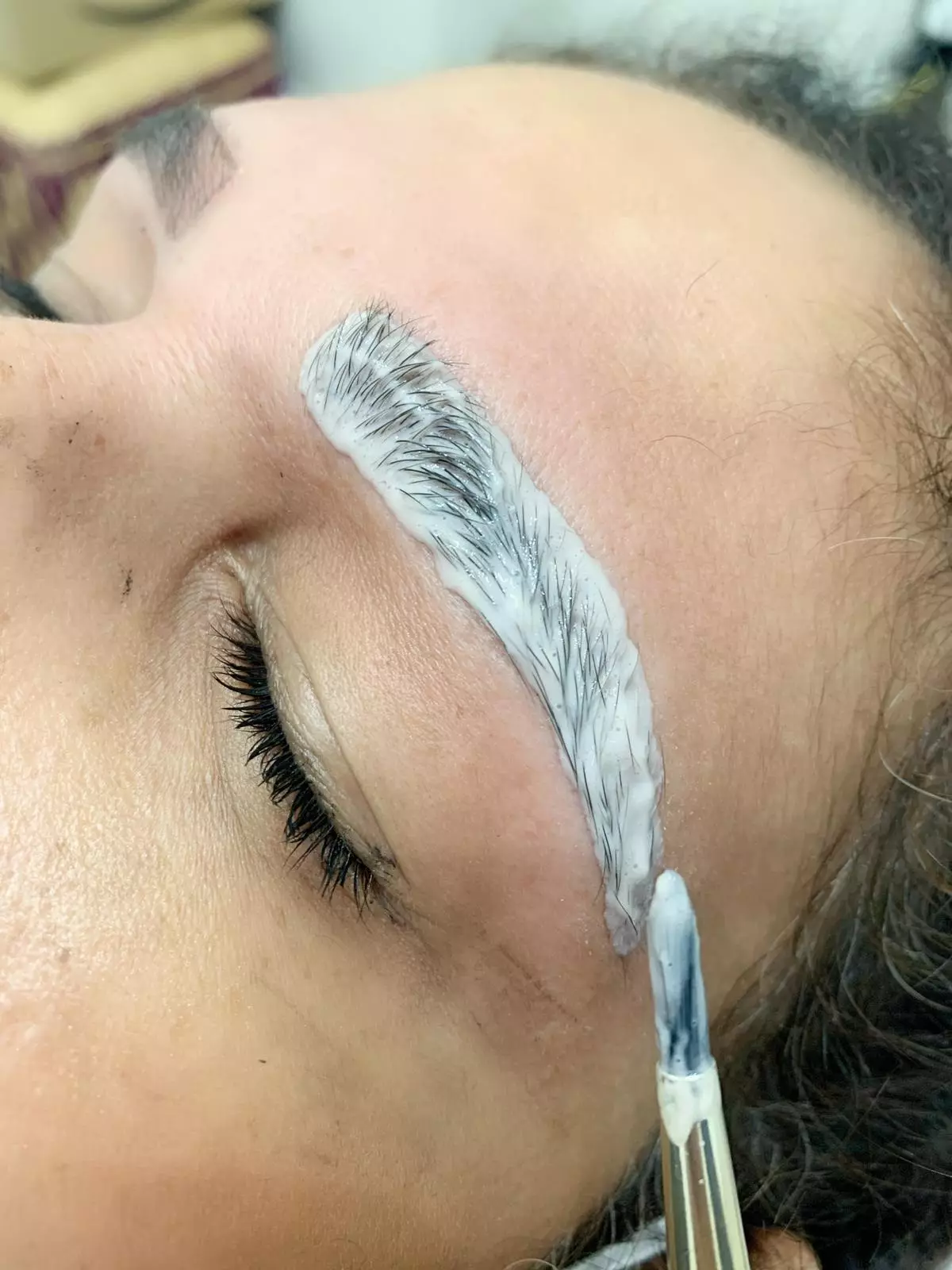 Use the applicator to coat your brows with tint, working outwards to the tail end of your brow (
