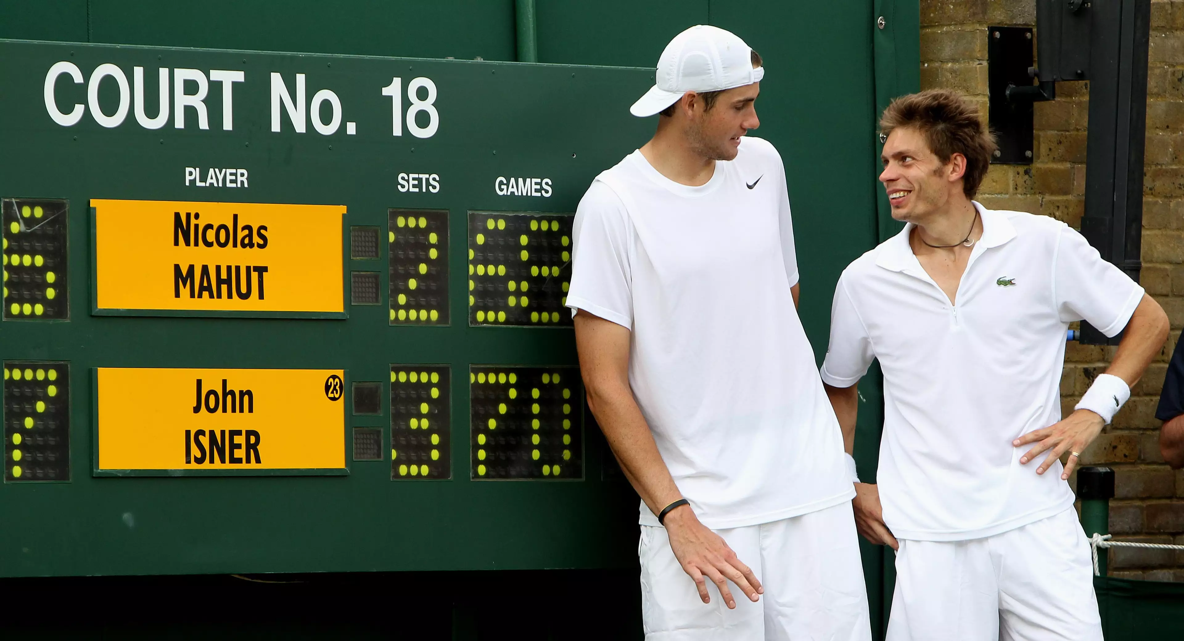 The two men standing by the scoreboard after the incredible match. Image: PA Images