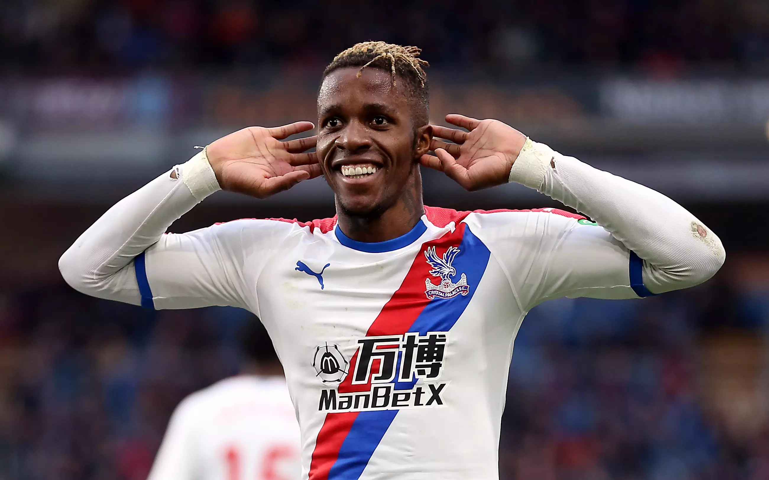 Zaha celebrating, but will he be celebrating a transfer soon? Image: PA Images