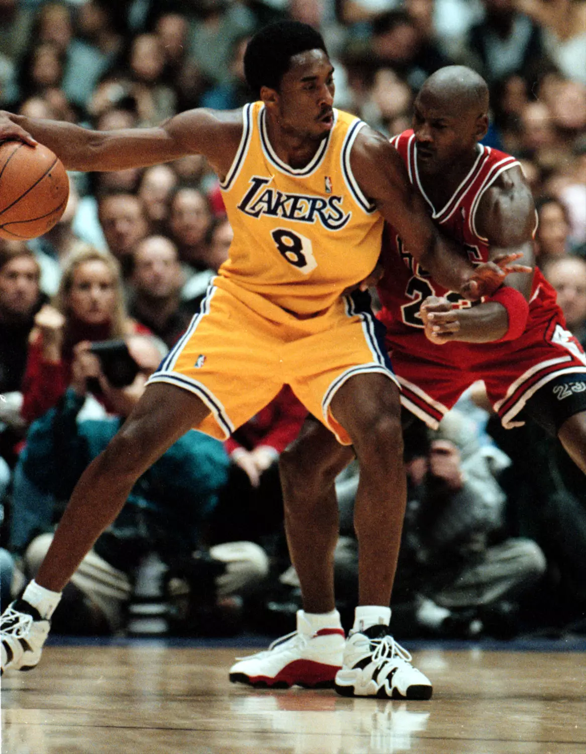 Kobe Bryant (left) going up against Michael Jordan.