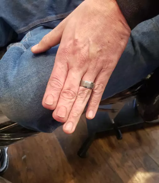 Hyper-realistic tattoo of fingernails.