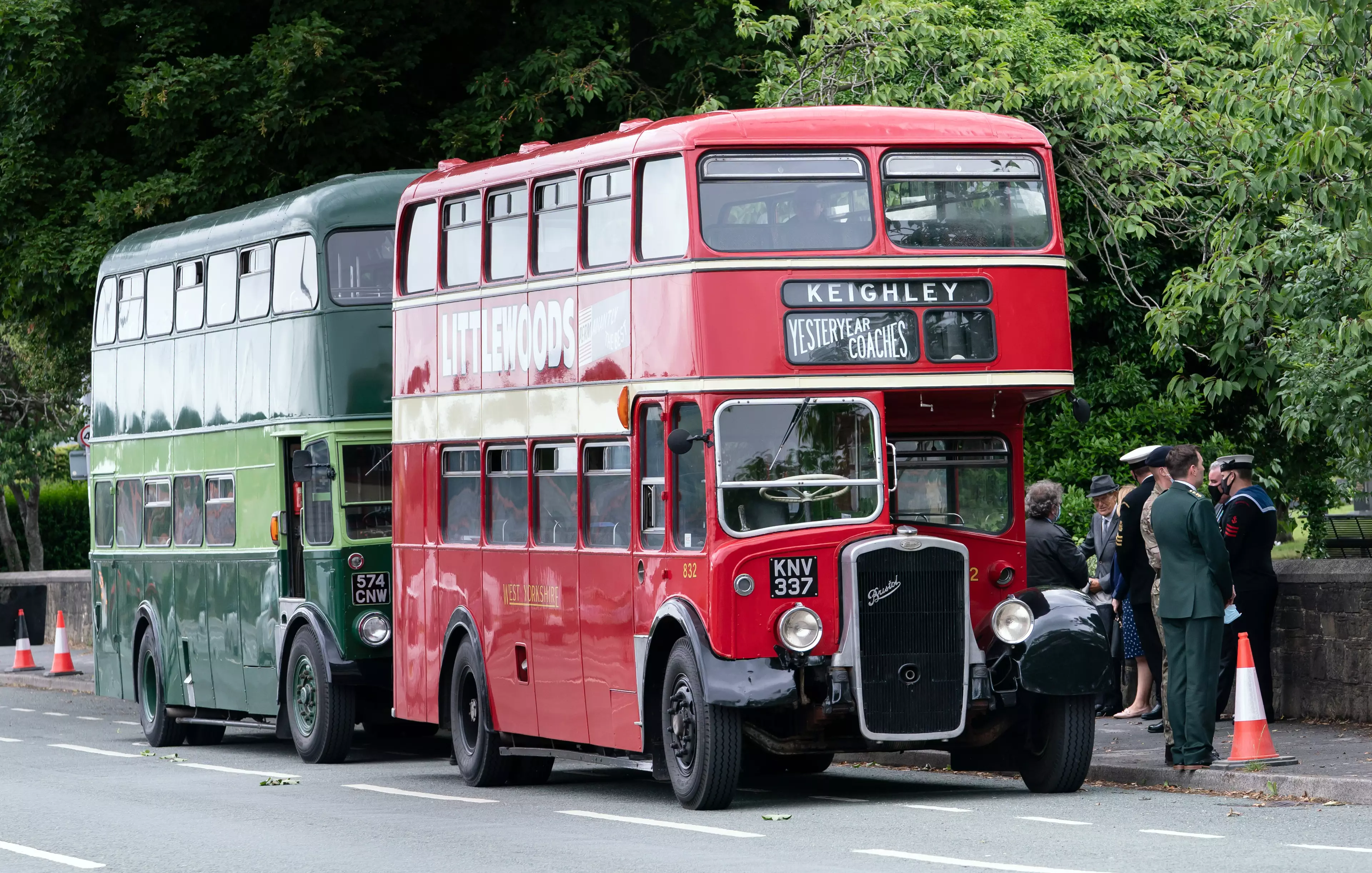 The guard of honour arrived on two vintage buses.