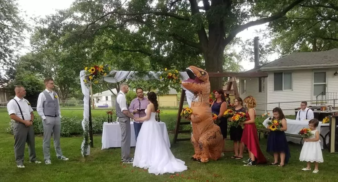 Bridesmaid Wears A T-Rex Outfit To Her Sister's Wedding And It's Amazing