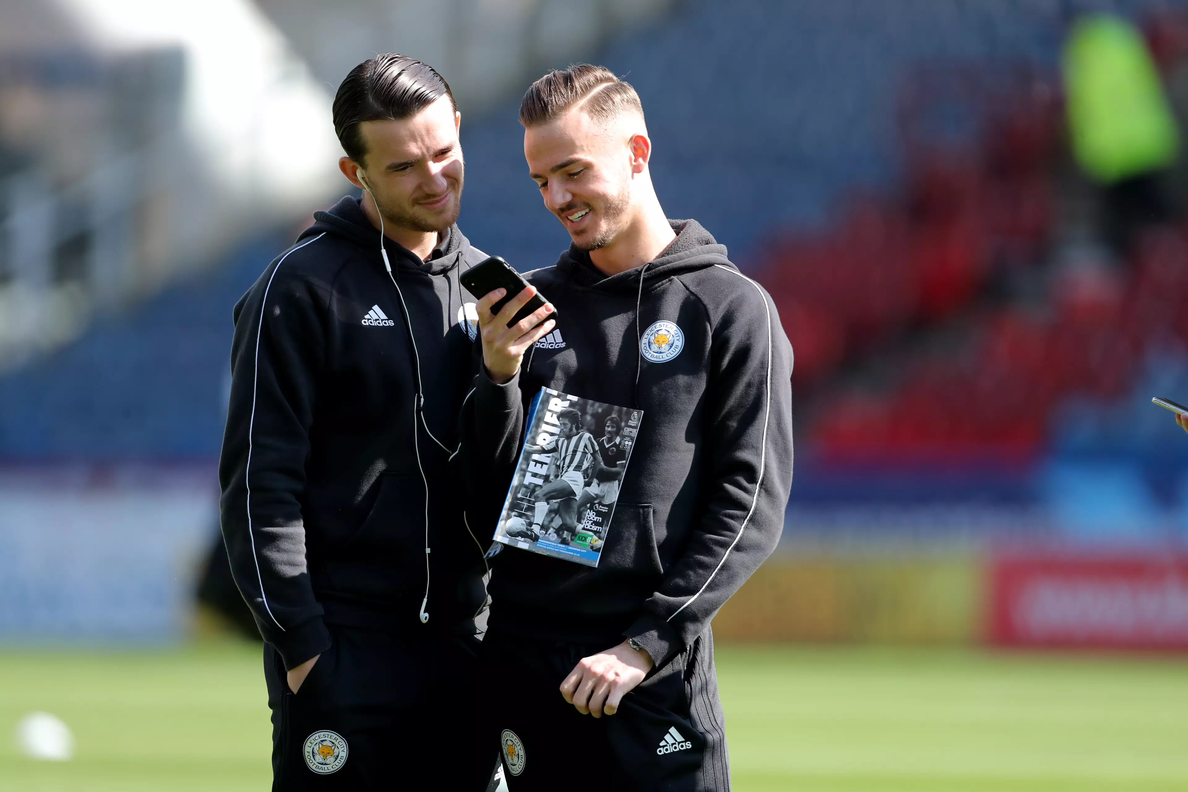 Maddison and Chilwell checking to find Manchester United on the Premier League table. 