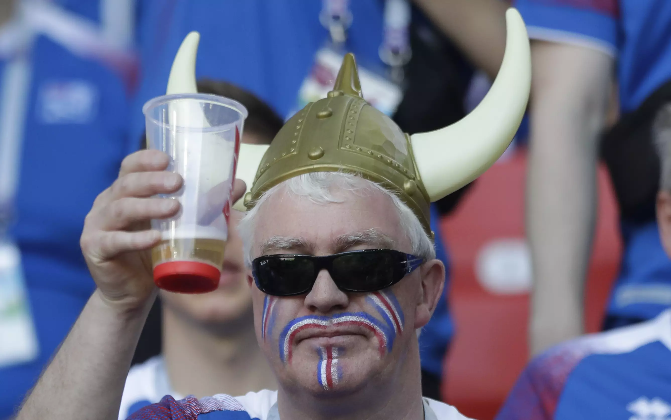 A fan toasts with a beer. Image: PA