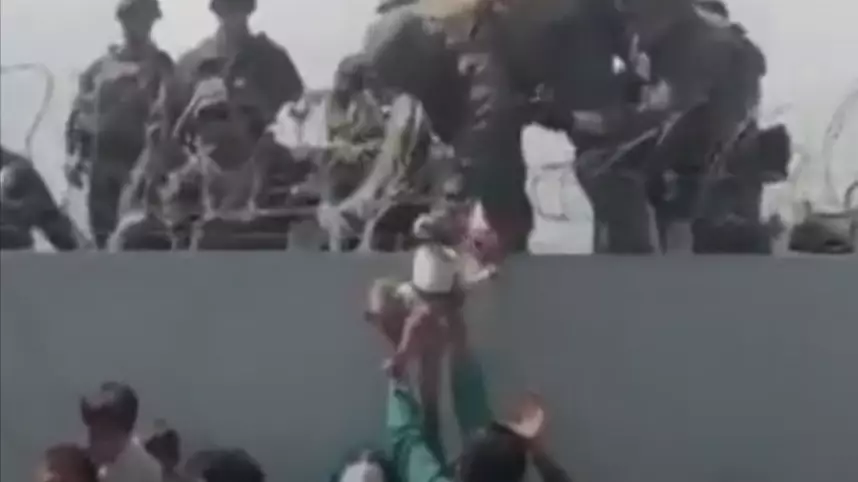 Baby Lifted Over Barbed Wire Fence At Kabul Airport Reunited With Father