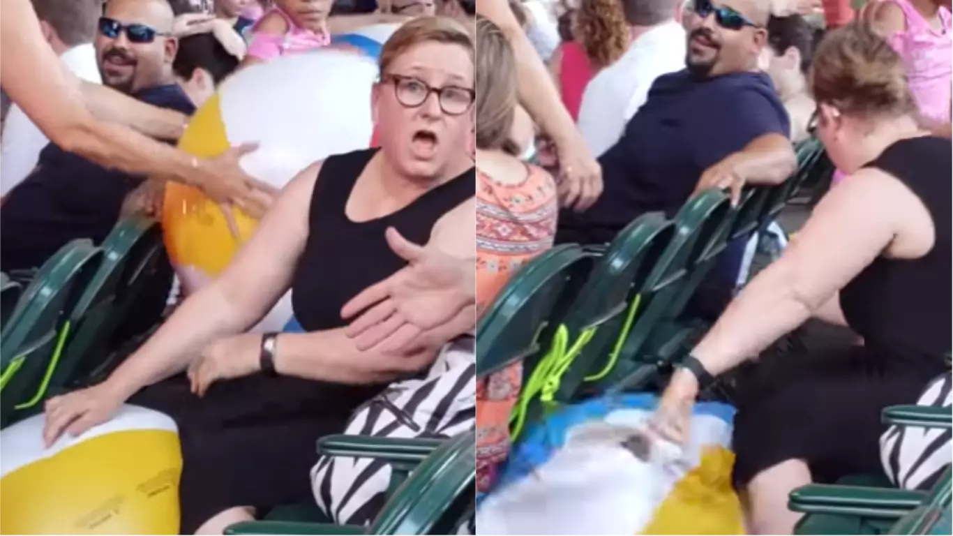 ​Woman Pops Kids' Beach Ball At Concert