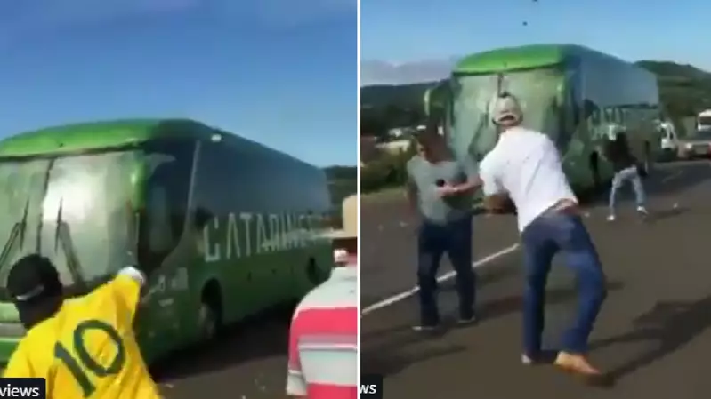 Brazil Fans 'Welcome Back' Players By Throwing Stones At Team Bus