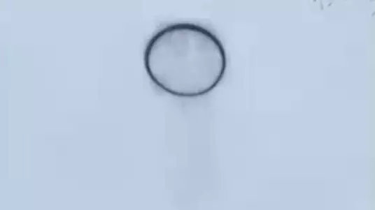 Security Footage Captures Black Smoke Ring UFO In Sky