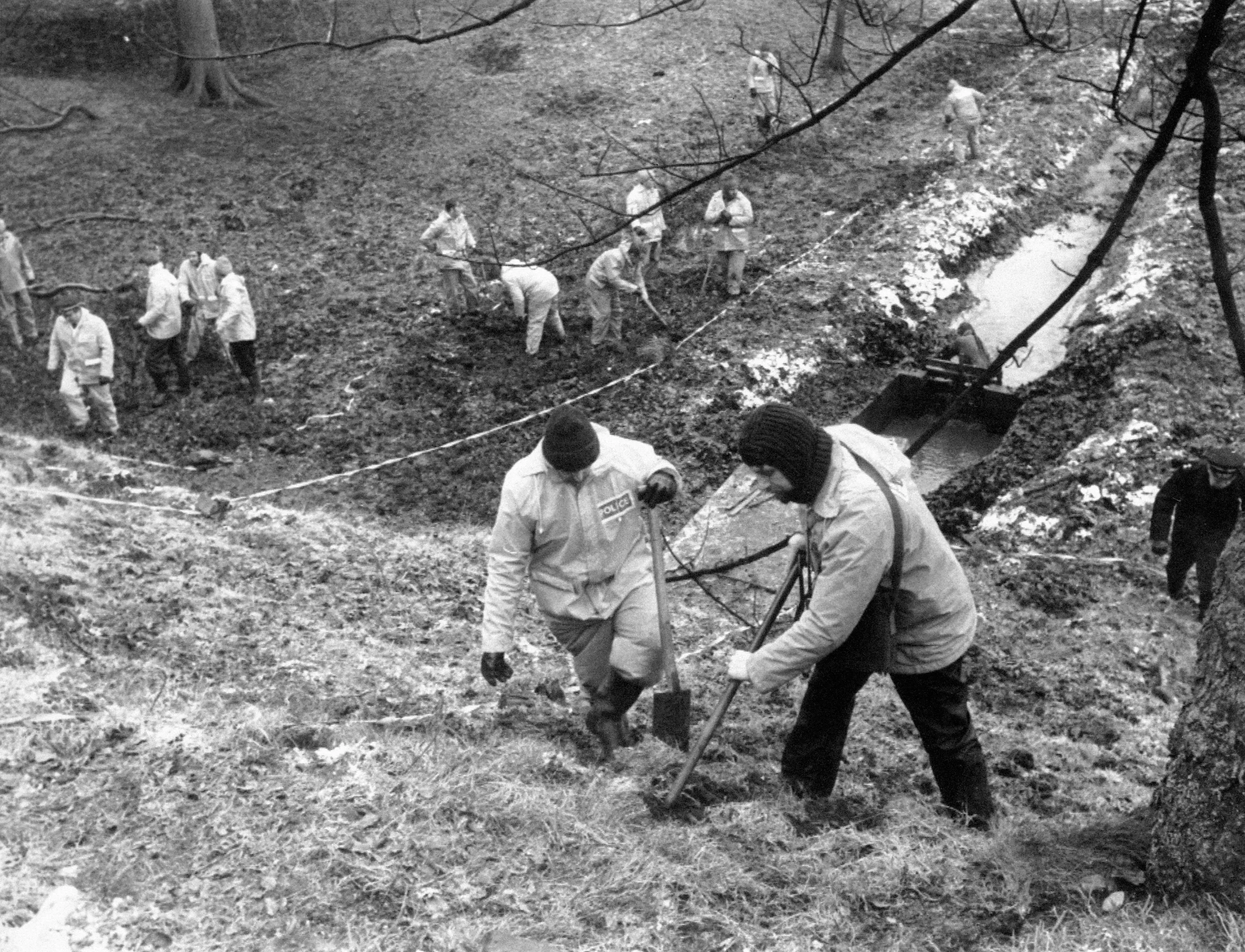 Police searching woodland near Sutcliffe's home in 1981.