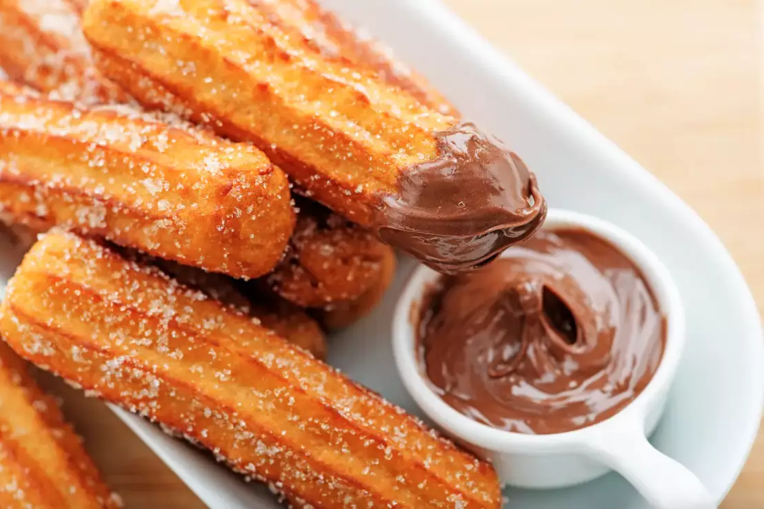 Churros are often served with chocolate dipping sauce (