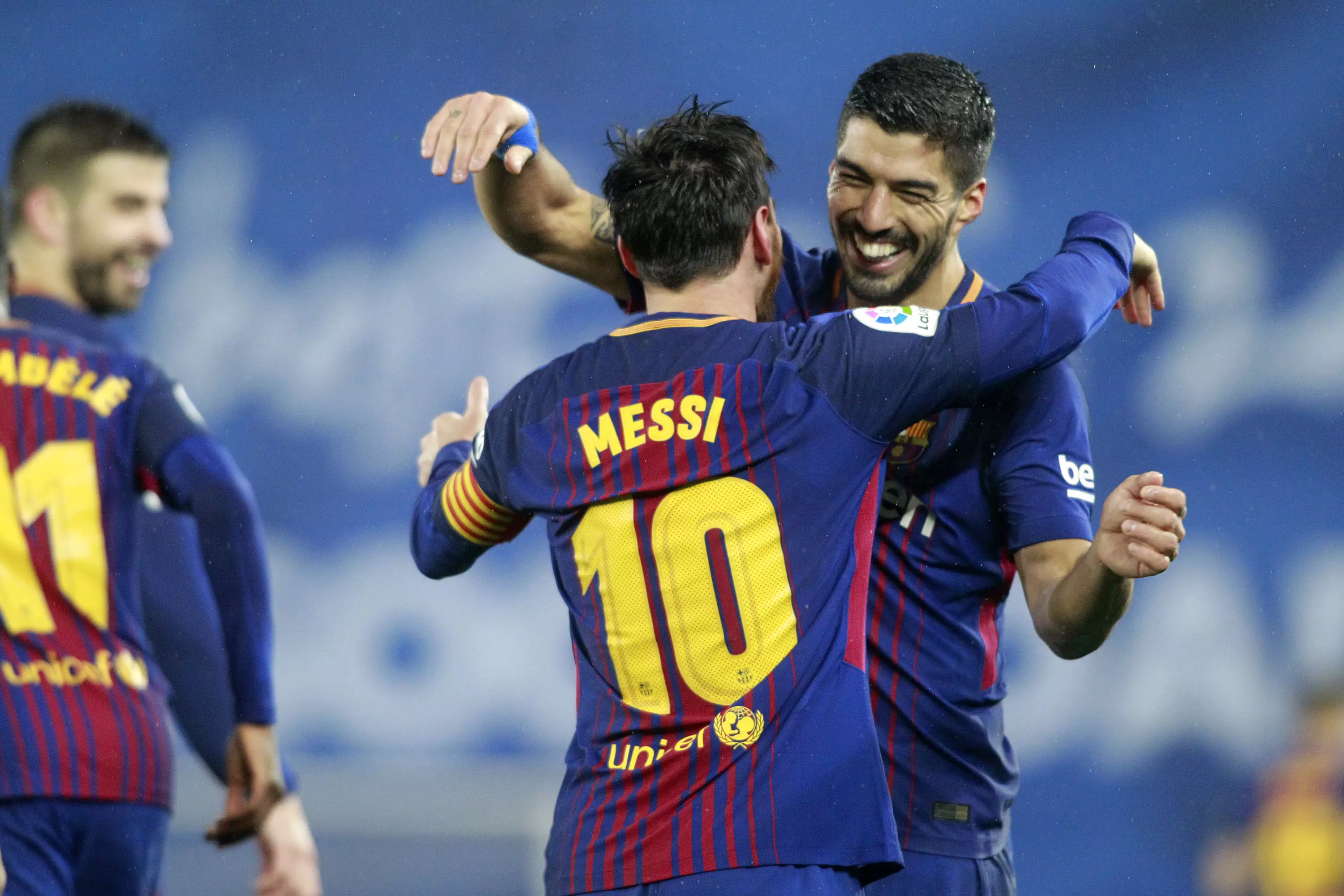 Messi and Suarez embrace. Image: PA