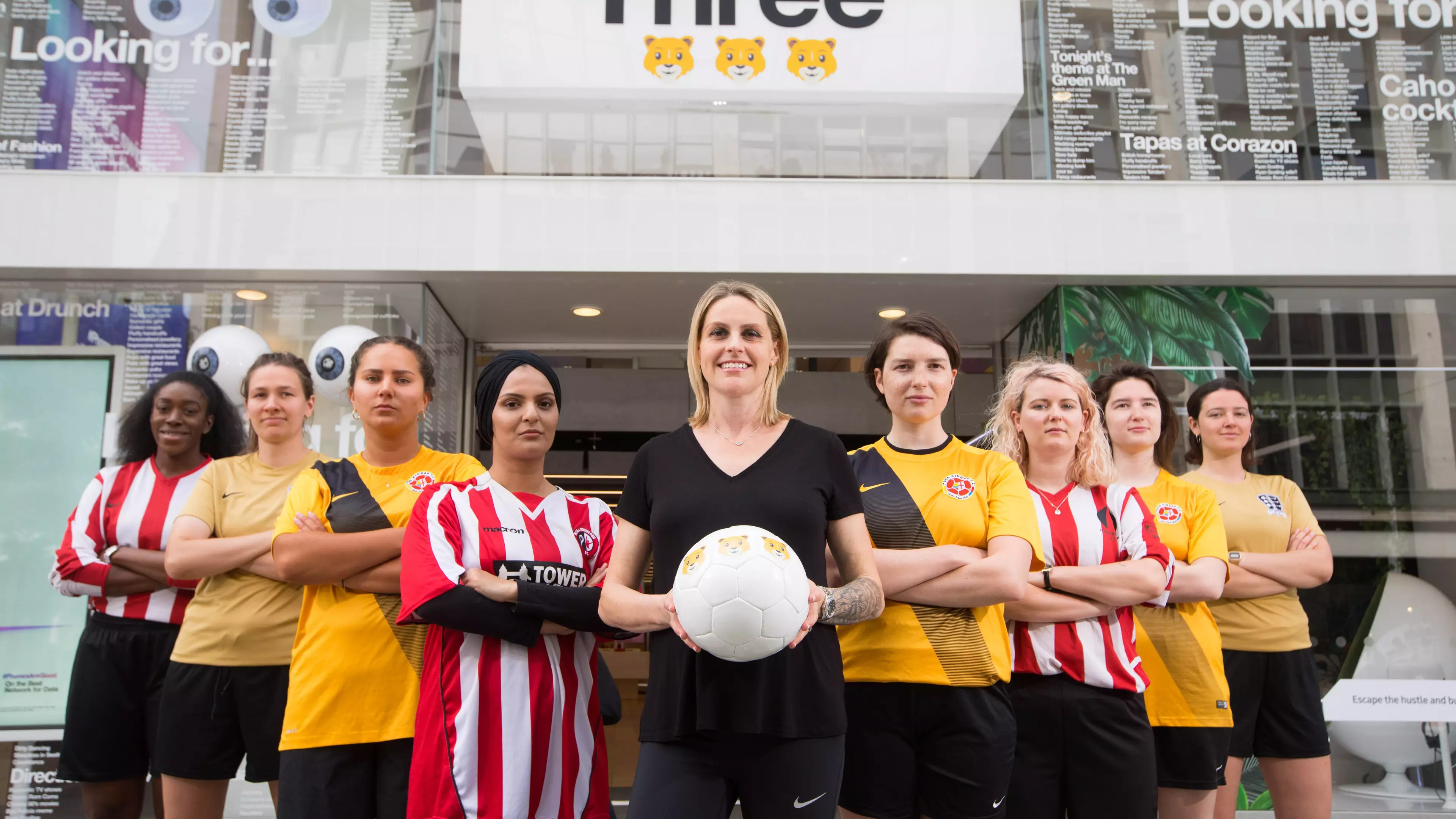 Kelly Smith and Women's Super 5 League players at the Three flagship store.