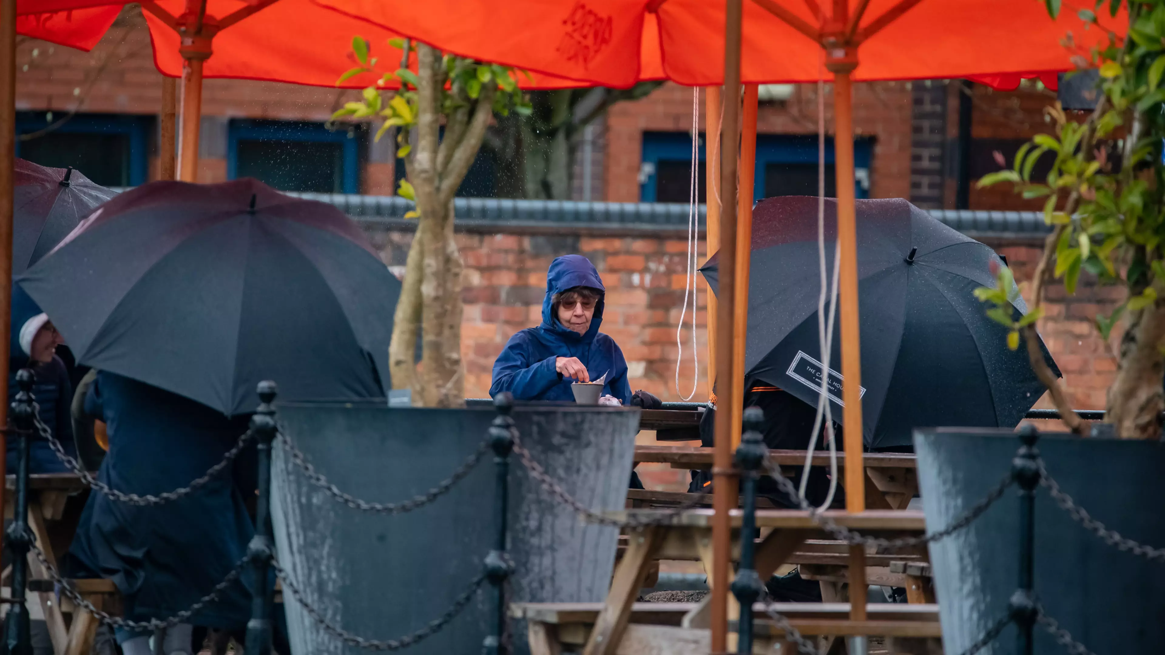 Brits Still Braving Beer Gardens Despite Torrential Rain
