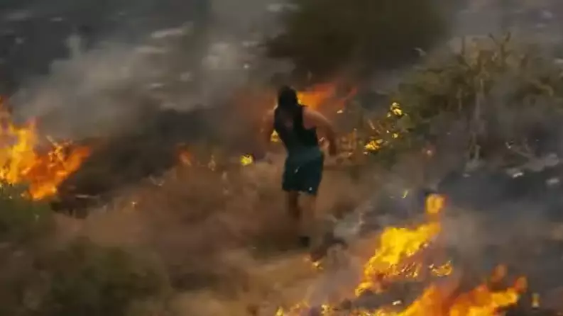 Jogger Tries To Put Wildfire Out With His Feet