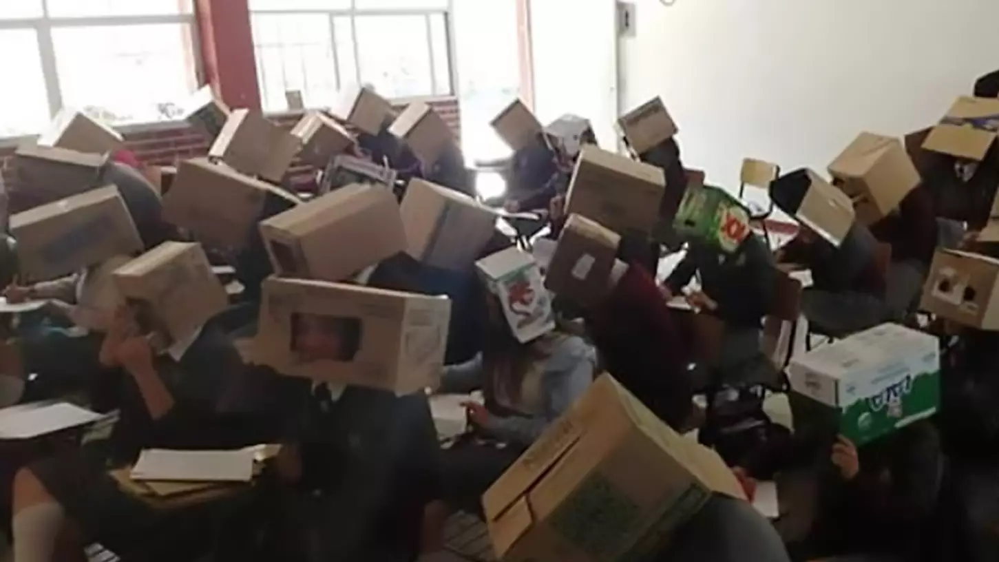 Teacher Stops Kids Cheating In Exam By Putting Cardboard Boxes On Their Heads