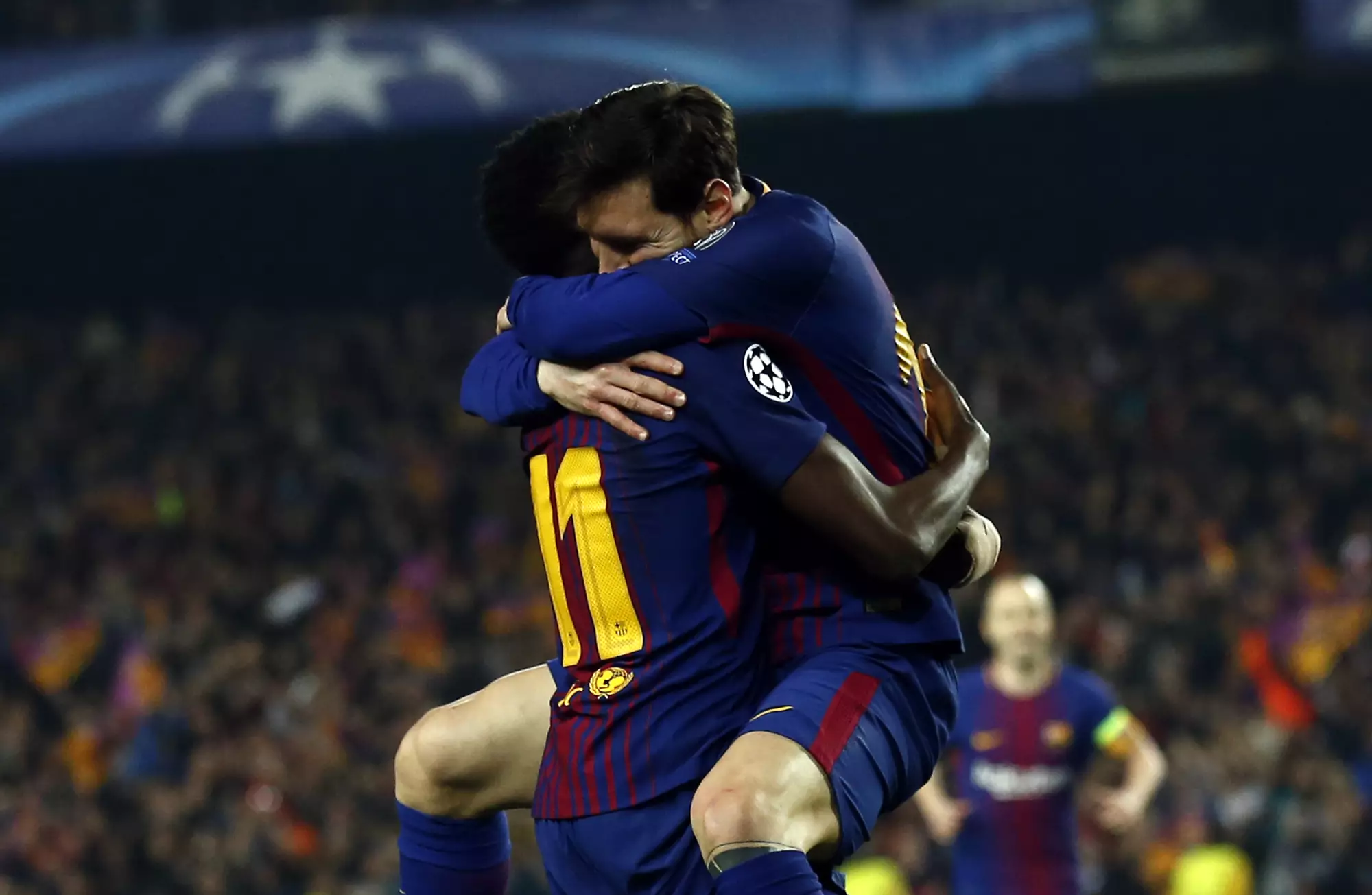 Messi celebrates with Dembele. Image: PA