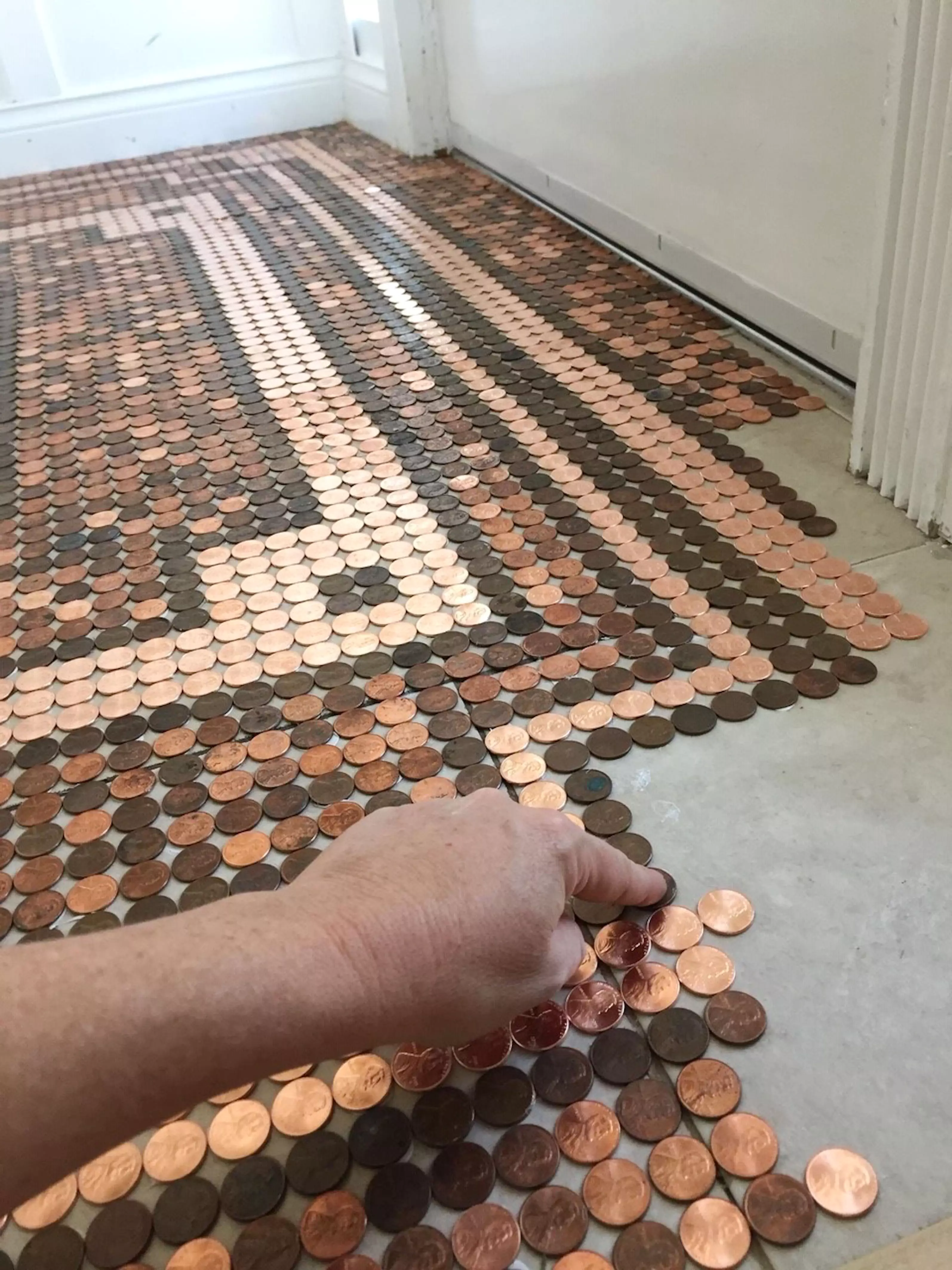 Kelly used 7,500 coins to complete the floor (