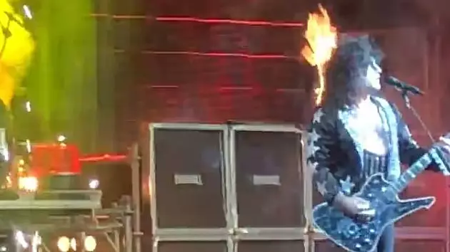 KISS Cover Band Guitarist Doesn't Skip A Note Despite Hair Exploding With Fire 