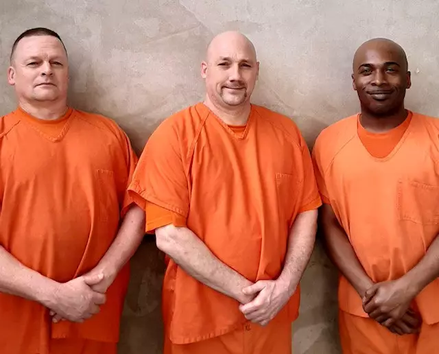 The three inmates rushed to save Deputy Hobbs' life.