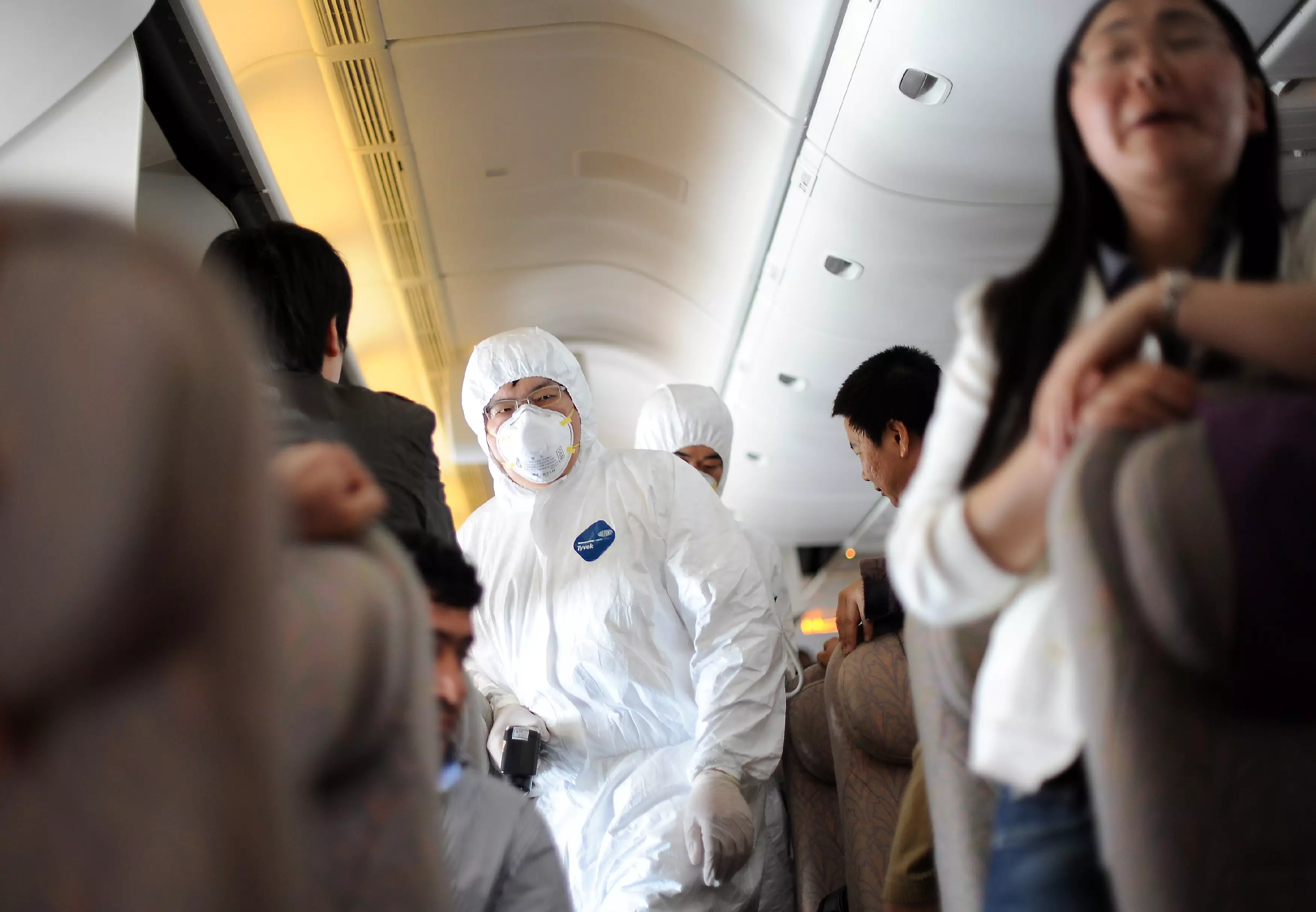 Health authorities checking a plane in 2009 amid the swine flu pandemic.