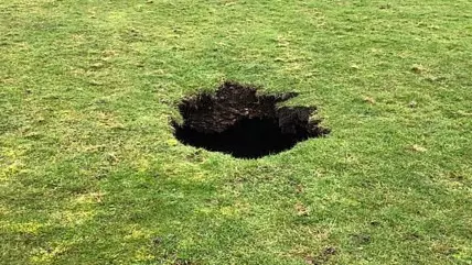 Huge 40 Foot Deep Sinkhole Opens Up In UK Playing Field