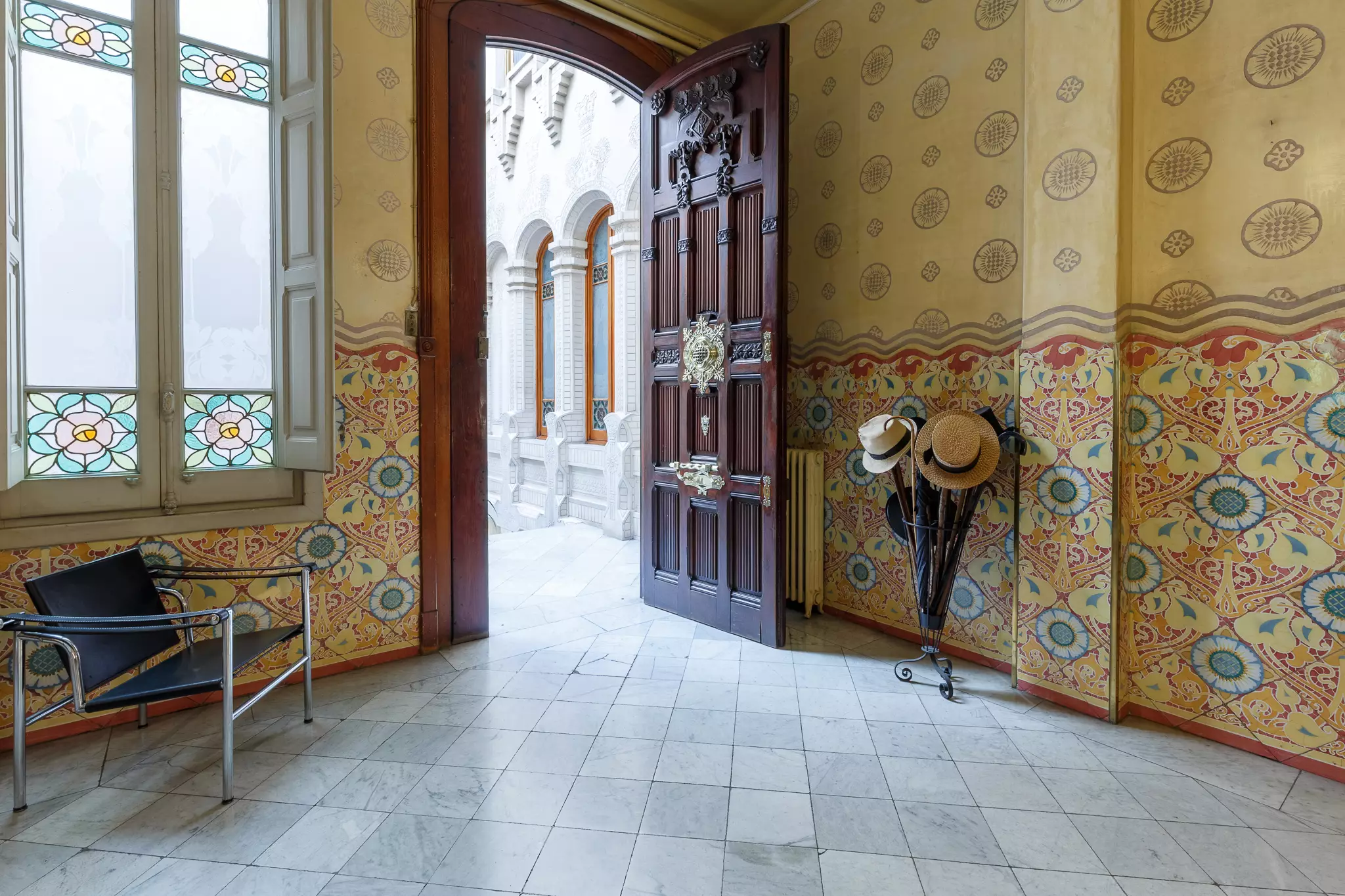 The interiors feature elaborately carved wooden doors and apricot-coloured tiles (