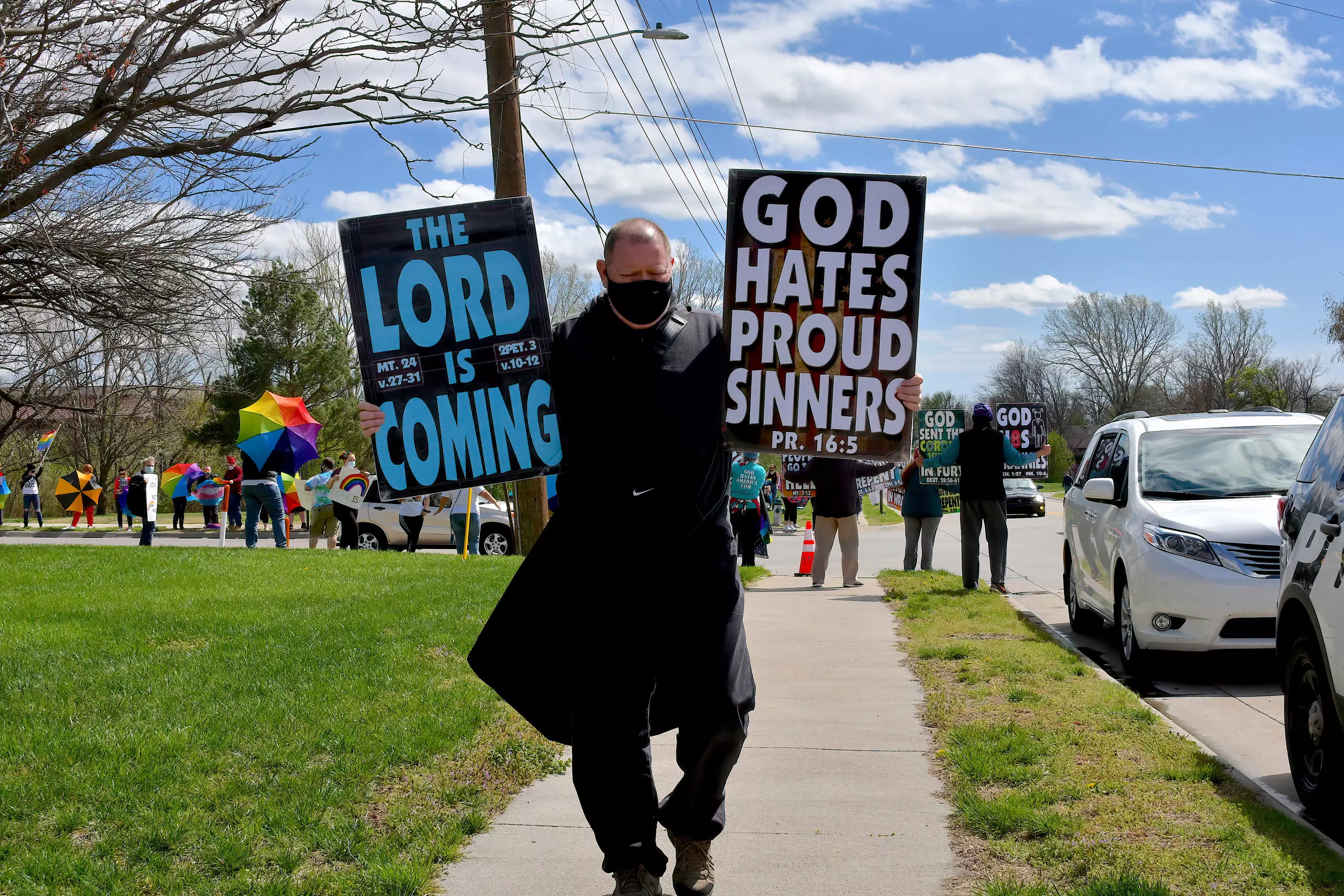 Members of the Westboro Baptist Church display their well known hate signs.