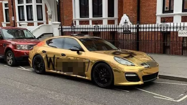 Businessman Has 'Wa***r' Painted On Gold Porsche After Lamborghini Set On Fire