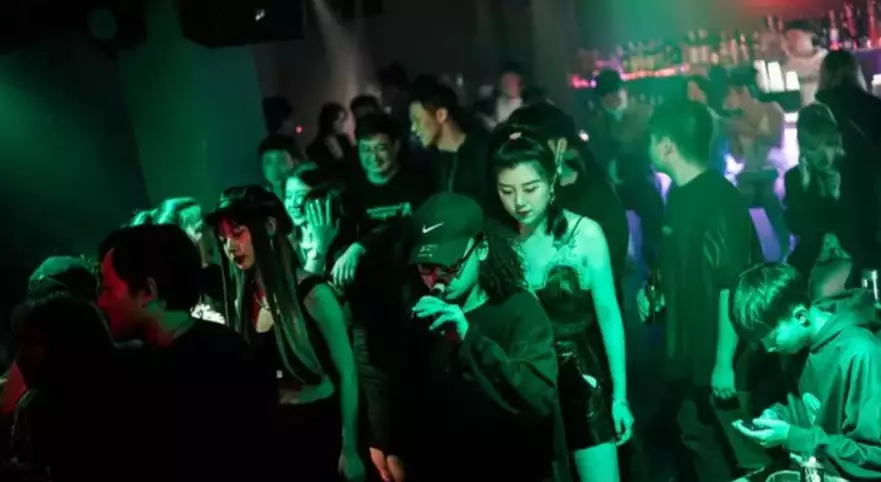 Clubbers in a Wuhan nightclub in September.