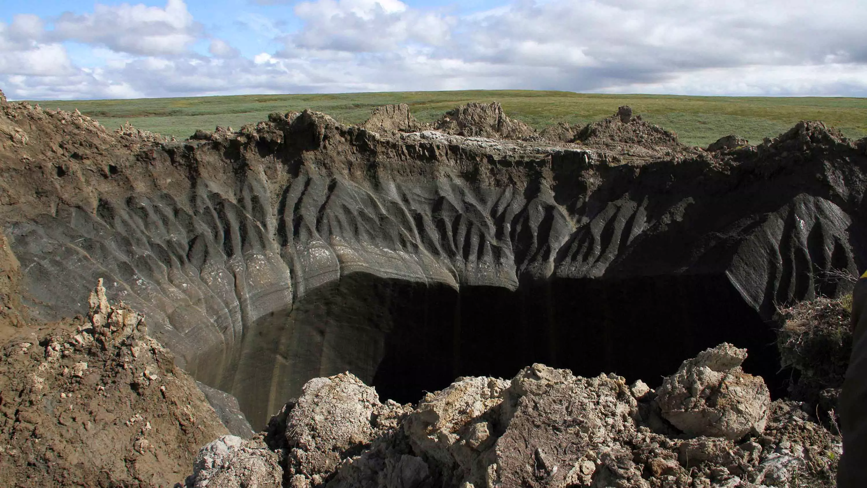 Gigantic 165ft Deep Crater Forms In Russia's Arctic Tundra After Explosion