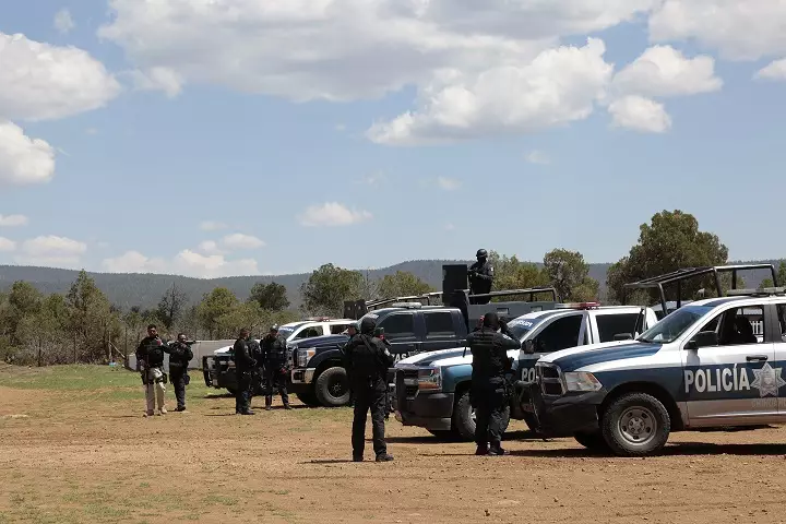 Police in Mexico following a clash between rival drug trafficking gangs.