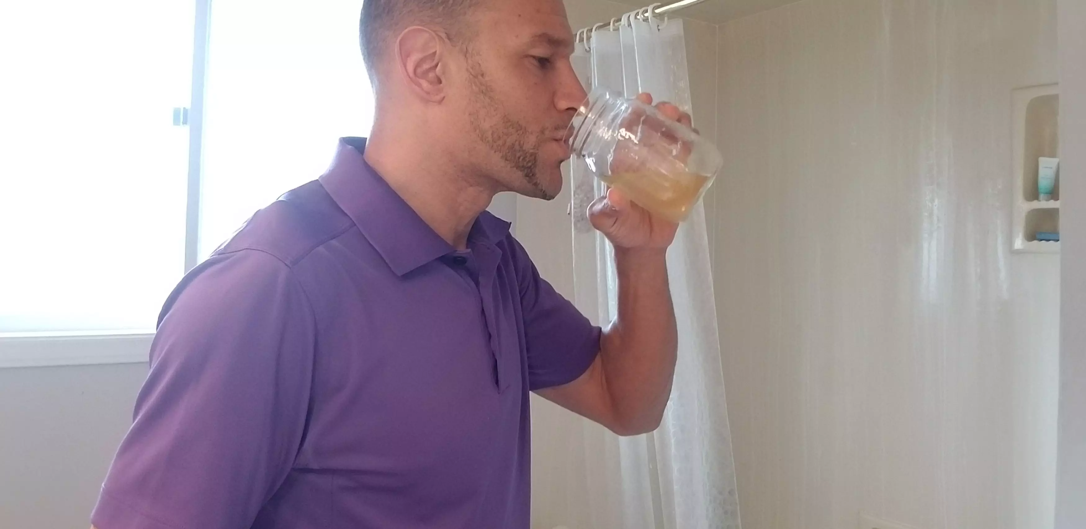 John DePass drinking his own urine as part of a strict diet.
