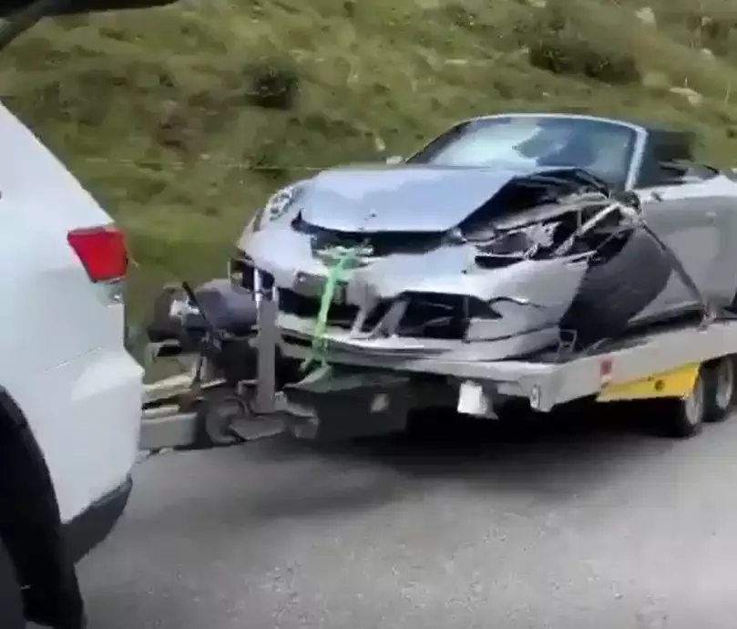 The Porsche was badly damaged by the crash.