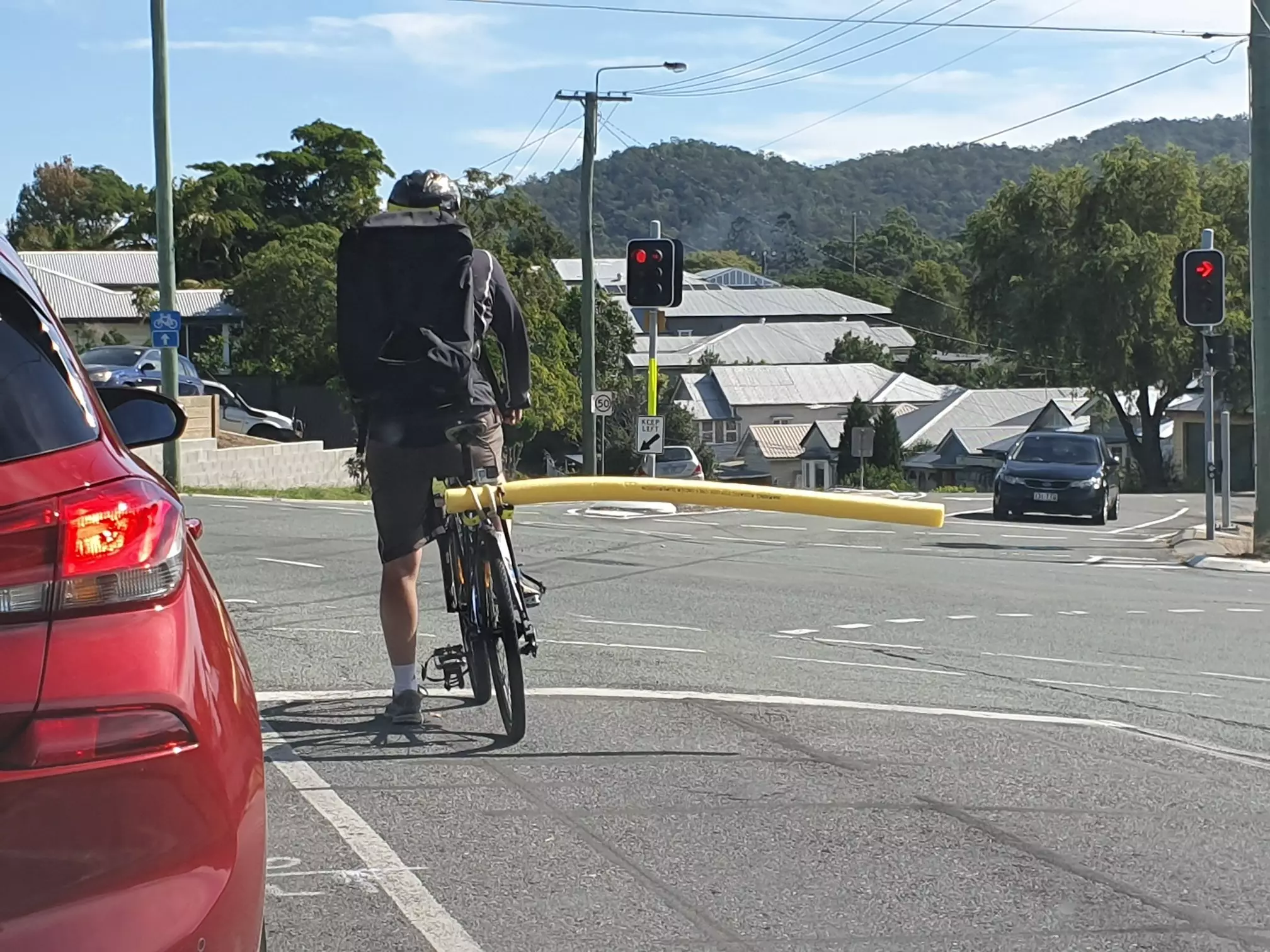 The cyclist took extreme measures to keep cars at a safe distance.