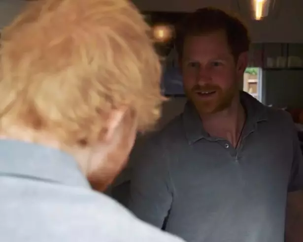 Prince Harry opens the door to Ed.