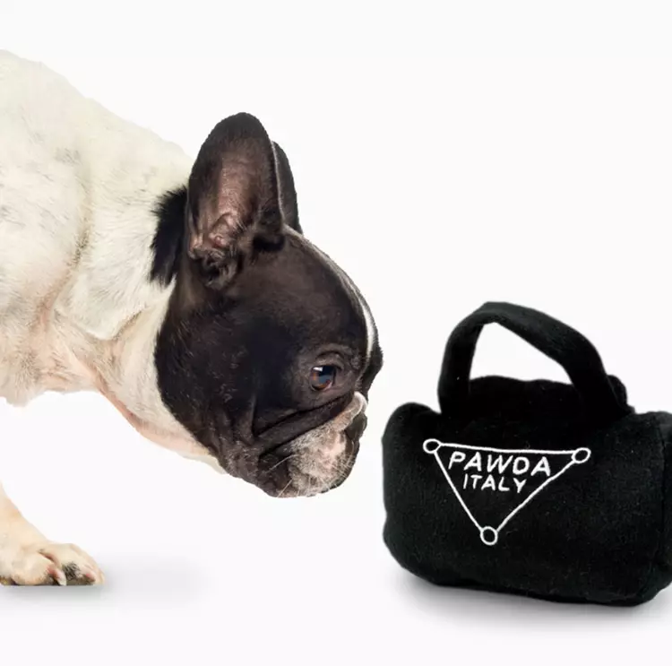 The Prada bag toy features the brand's iconic logo (