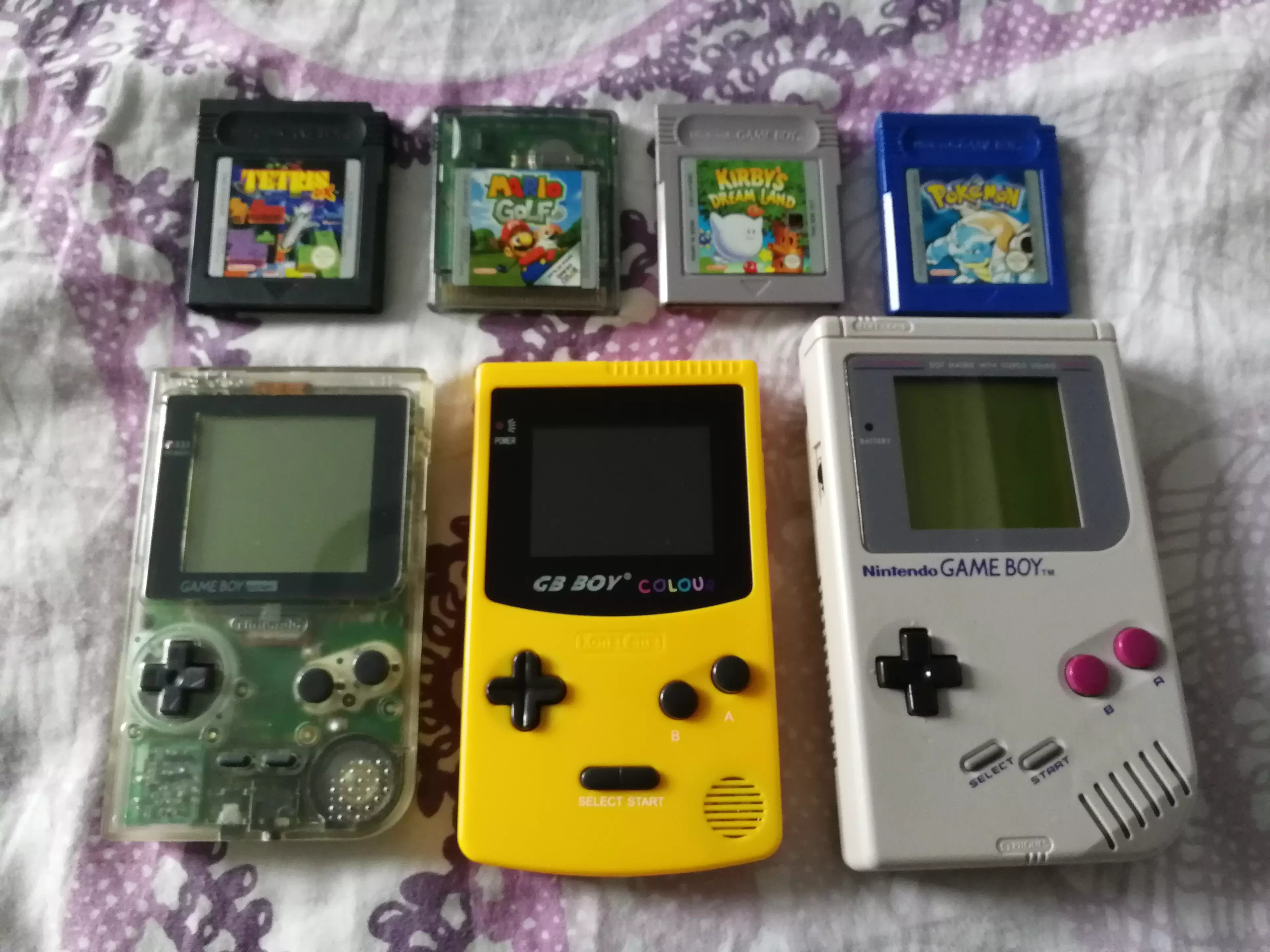 The GB Boy Colour next to a Pocket and original Game Boy /