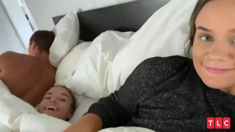 Two Adult Sisters Still Sleep In The Same Bed Together With One Of Their Husbands