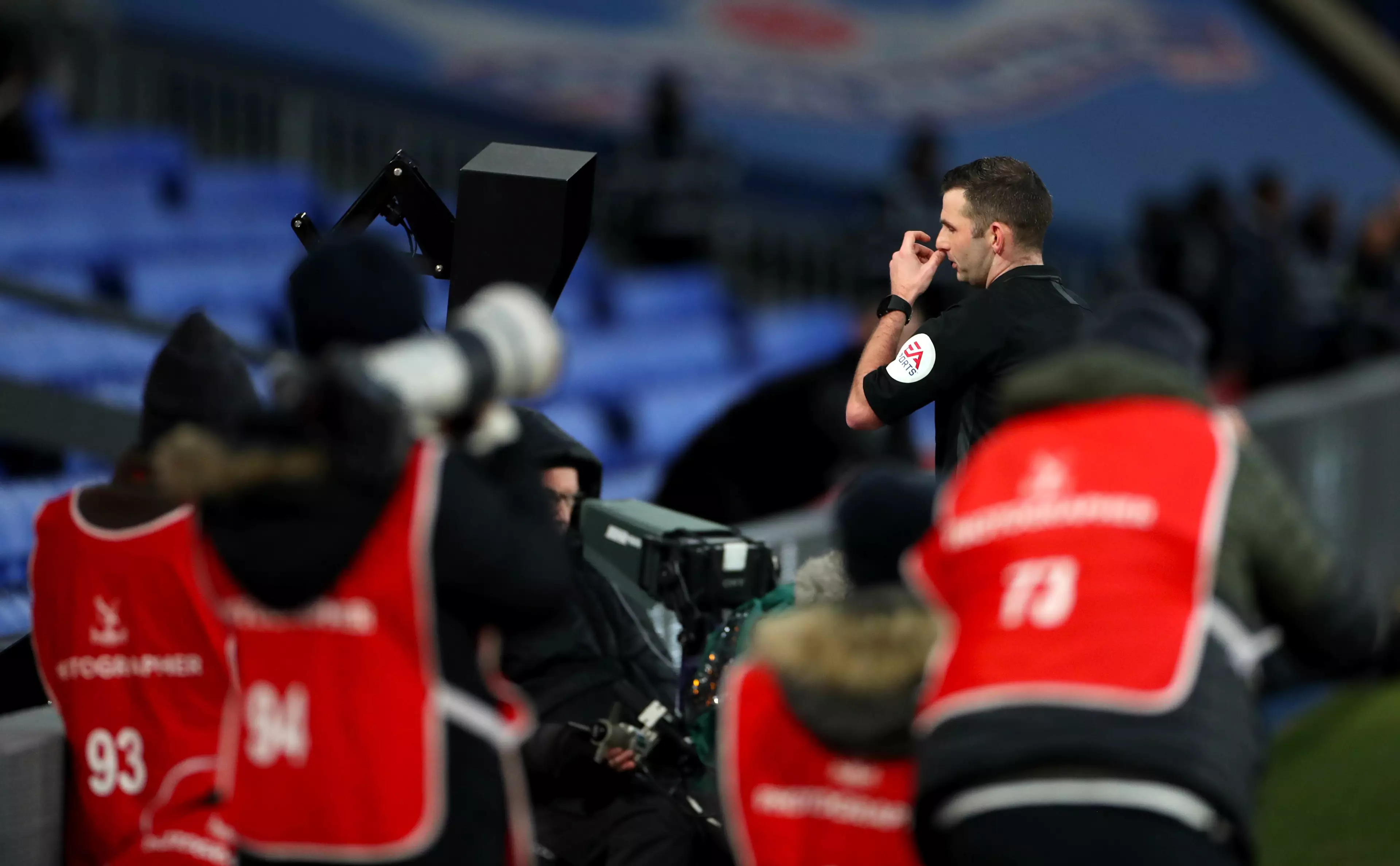 Michael Oliver checks the screen. Image: PA Images